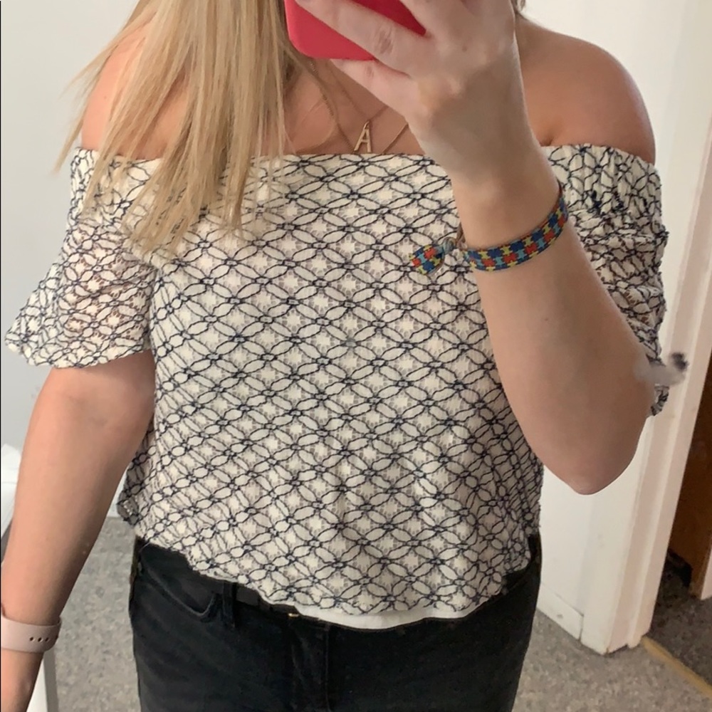 White off the shoulder shirt with blue flowers